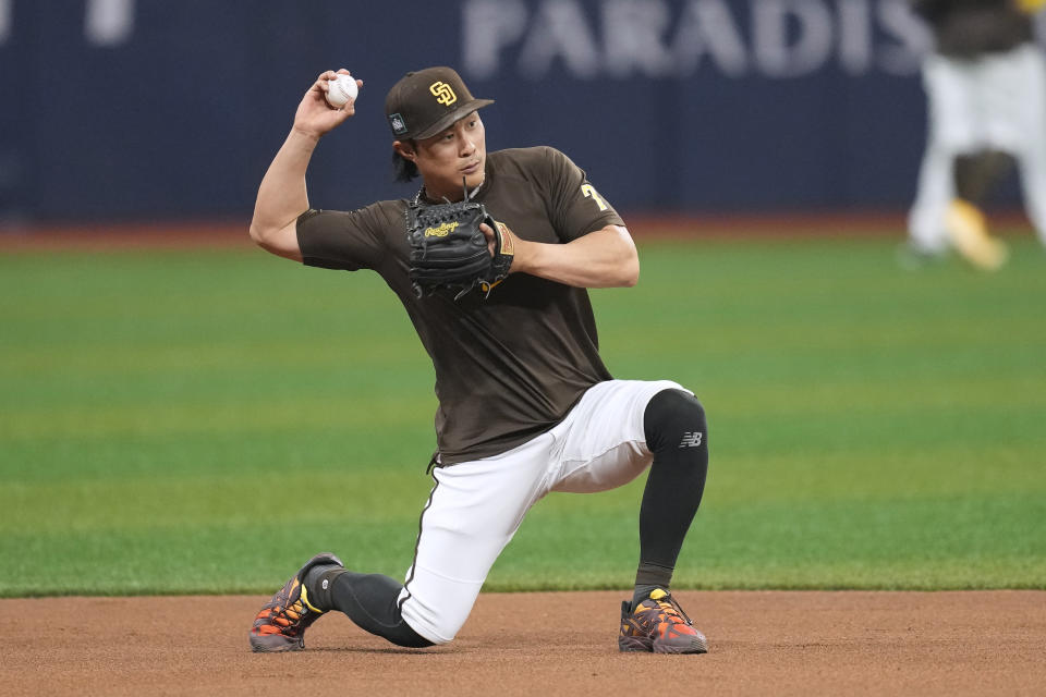 San Diego Padres Ha-Seong Kim fields a ground ball during a baseball workout at the Gocheok Sky Dome in Seoul, South Korea, Tuesday, March 19, 2024. Major League Baseball's season-opening games between the Los Angeles Dodgers and San Diego Padres in Seoul will be the first MLB games held in the baseball-loving nation. (AP Photo/Lee Jin-man)