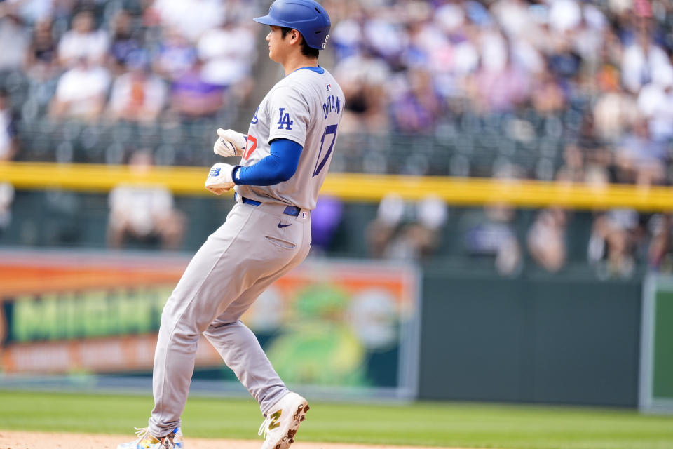 Los Angeles Dodgers' Shohei Ohtani pulls in to second base on a double steal in the eighth inning of a baseball game against the Colorado Rockies, Sunday, Sept. 29, 2024, in Denver. (AP Photo/David Zalubowski)