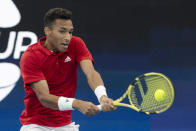 Felix Auger-Aliassime of Canada plays a shot against Russia's Daniil Medvedev during their semifinal match at the ATP Cup tennis tournament in Sydney, Saturday, Jan. 8, 2022. (AP Photo/Steve Christo)