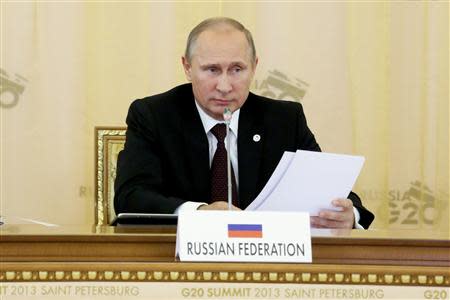 Russian President Vladimir Putin attends the first working session of the G20 Summit in Constantine Palace in Strelna near St. Petersburg, September 5, 2013. REUTERS/Sergei Karpukhin