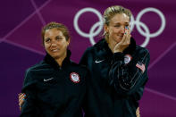 Gold medallists Misty May-Treanor and Kerri Walsh Jennings celebrate on the podium during the medal ceremony for the Women's Beach Volleyball on Day 12 of the London 2012 Olympic Games at the Horse Guard's Parade on August 8, 2012 in London, England. (Photo by Jamie Squire/Getty Images)