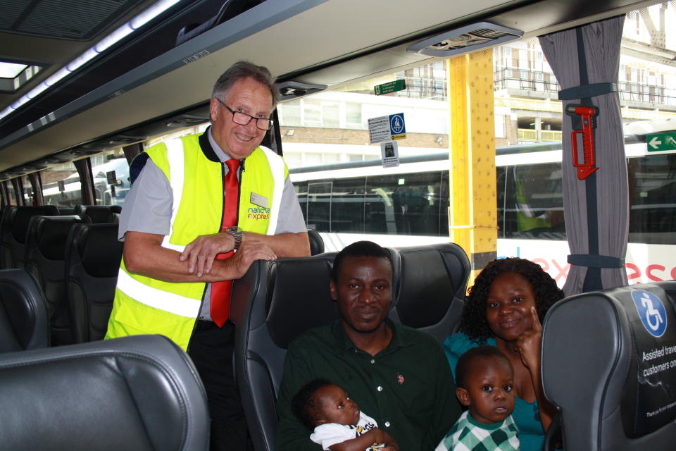 Driver with family of four sat inside coach