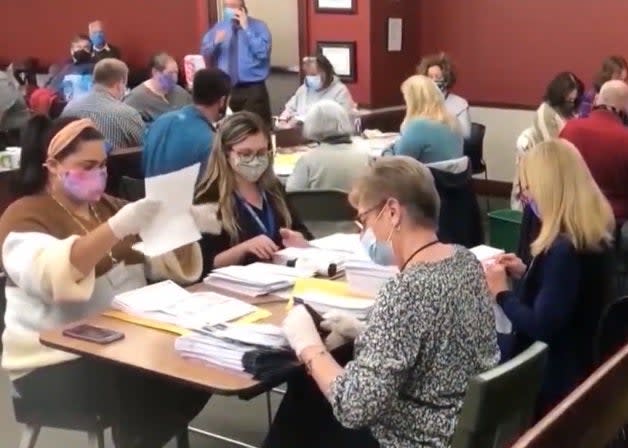 <p>Workers tally ballots in Cobb County, Georgia following the 3 November elections</p> (Fox News)