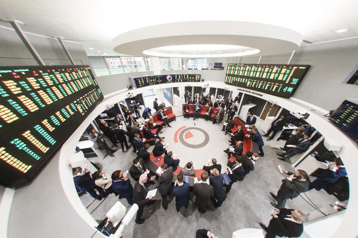 Traders during an open outcry trading session in 'The Ring' at the London Metal Exchange in London. Photo: Matt Crossick/ EMPICS PA