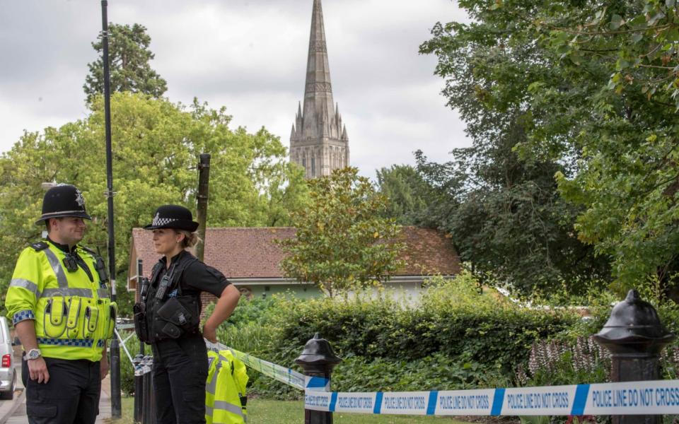 A police officer stands at a cordon outside Queen Elizabeth Gardens in Salisbury