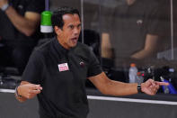 Miami Heat head coach Erik Spoelstra directs his team during the first half of an NBA conference final playoff basketball game against the Boston Celtics Sunday, Sept. 27, 2020, in Lake Buena Vista, Fla. (AP Photo/Mark J. Terrill)