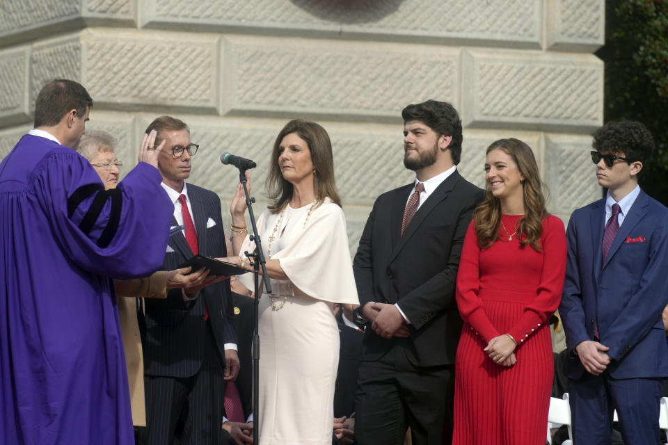 South Carolina Lt. Gov. Pamela Evette, center, is sworn in for her second term of office by state House Speaker Murrell Smith, left, as her family looks on during inaugural exercises on Wednesday, Jan. 11, 2023, in Columbia, S.C. (AP Photo/Meg Kinnard)