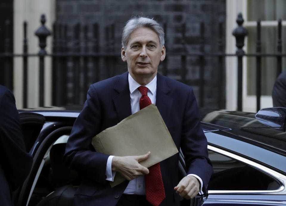 Britain's Chancellor of the Exchequer Philip Hammond arrives in Downing Street. London, Thursday Jan. 17, 2019. British Prime Minister Theresa May is reaching out to opposition parties and other lawmakers Thursday in a battle to put Brexit back on track after surviving a no-confidence vote. (AP Photo/Matt Dunham)