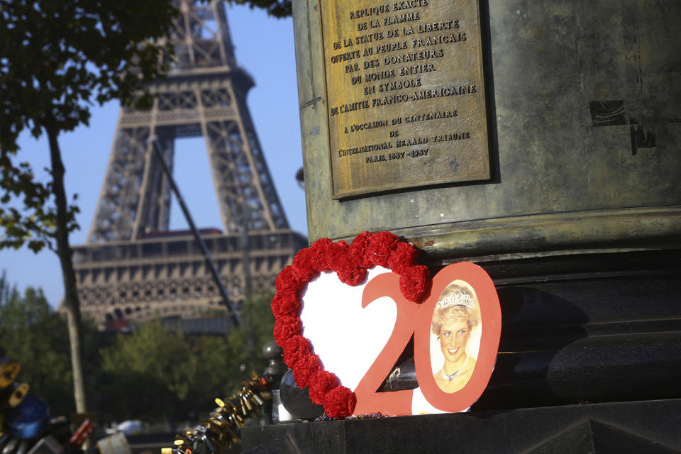 <p>Photographs and flowers are placed by people in memory of the late Princess Diana above the Pont de l’Alma tunnel in Paris, Aug. 31, 2017. (Photo: Thibault Camus/AP) </p>
