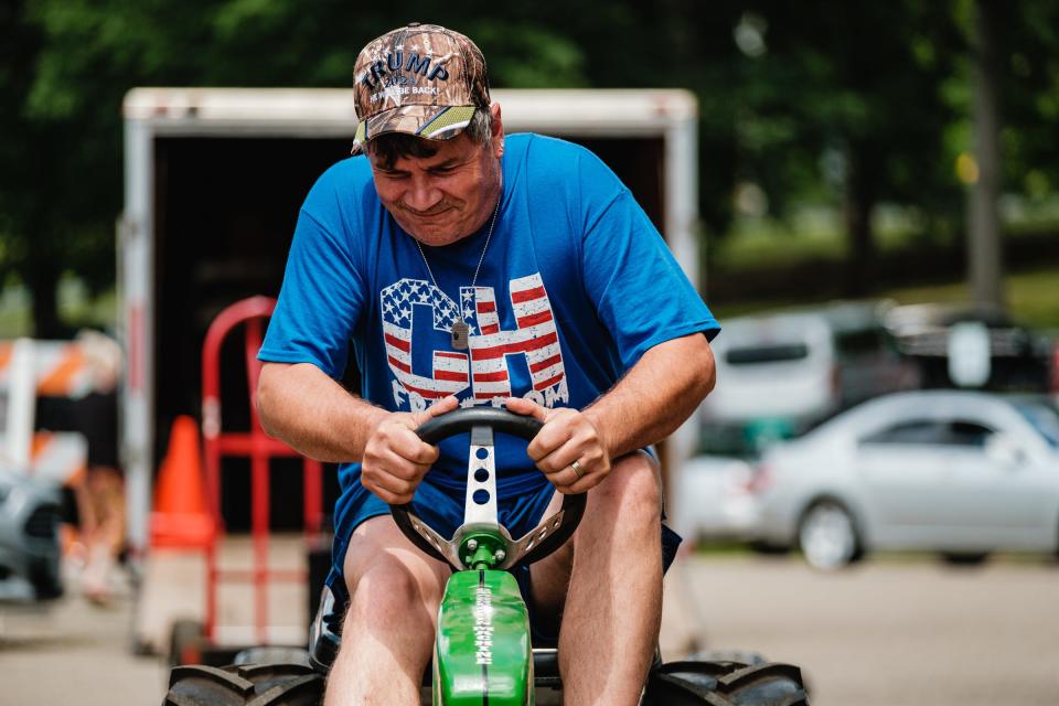 New Philadelphia resident Terry Snyder won the adult pedal tractor pull during the 2021 First Town Days Festival at Tuscora Park. TIMES-REPORTER/ANDREW DOLPH