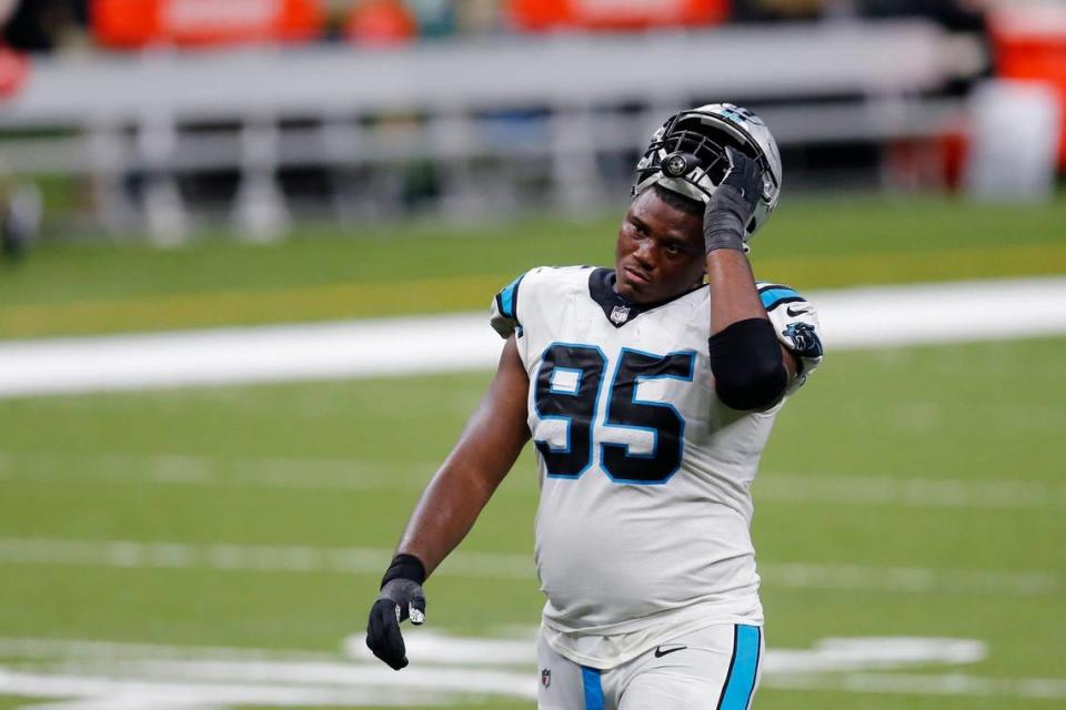 Carolina Panthers defensive tackle Derrick Brown (95) walks off the field after an NFL football game against the New Orleans Saints in New Orleans, Sunday, Oct. 25, 2020. The Saints won 27-24. (AP Photo/Brett Duke)