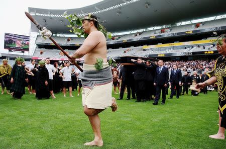 A Maori warrior leads the official party carrying the casket of former All Black player Jonah Lomu during a memorial service at Eden Park in Auckland, New Zealand November 30, 2015. REUTERS/Hannah Peters/Pool