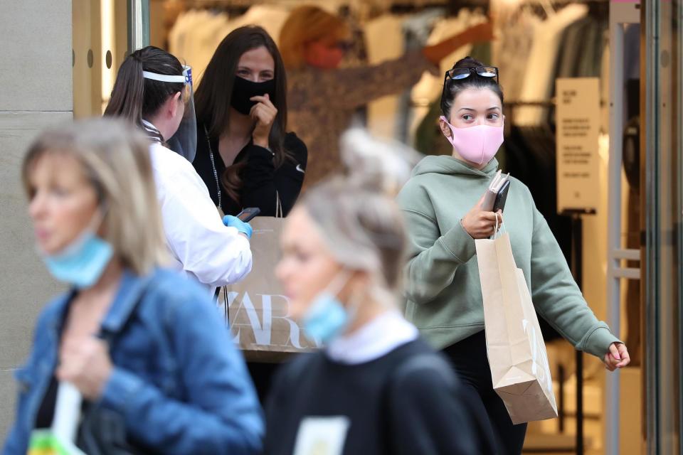 Customers will have to wear a face-covering in shops at the end of July (PA)