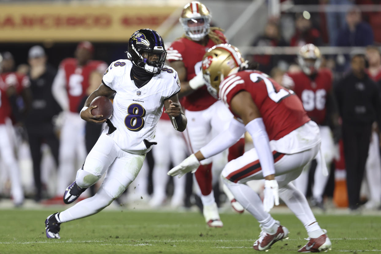 Baltimore Ravens quarterback Lamar Jackson (8) runs against the San Francisco 49ers during the first half of an NFL football game in Santa Clara, Calif., Monday, Dec. 25, 2023. (AP Photo/Jed Jacobsohn)