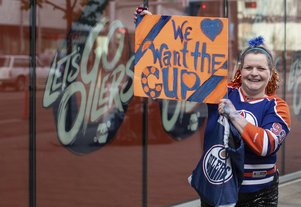 An Edmonton Oilers fan shows her support for the Edmonton Oilers as they take on the Vancouver Canucks prior to Game 4 of an NHL Stanley Cup second-round NHL playoff series Tuesday May 14, 2024 in Edmonton, Alberta (Jason Franson/The Canadian Press via AP)