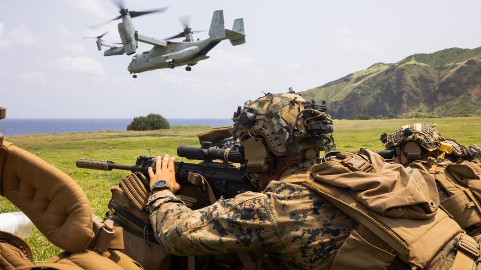 U.S. Marines with 3d Littoral Combat Team, along with U.S. soldiers and Philippine marines, secure a landing zone during the Balikatan exercise on Basco, Philippines, in April 2023. (Sgt. Patrick King/U.S. Marine Corps)