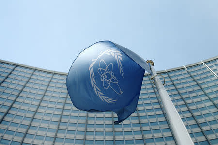 The flag of the International Atomic Energy Agency (IAEA) flies in front of its headquarters in Vienna, Austria, May 28, 2015. REUTERS/Heinz-Peter Bader