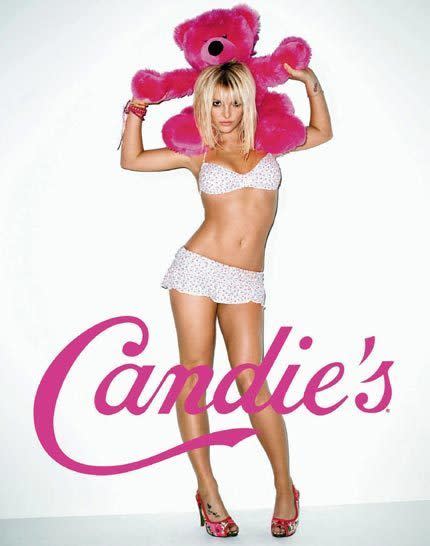 Britney in panties, a bra, and heels, carrying a stuffed pink bear like a baby. Obviously.