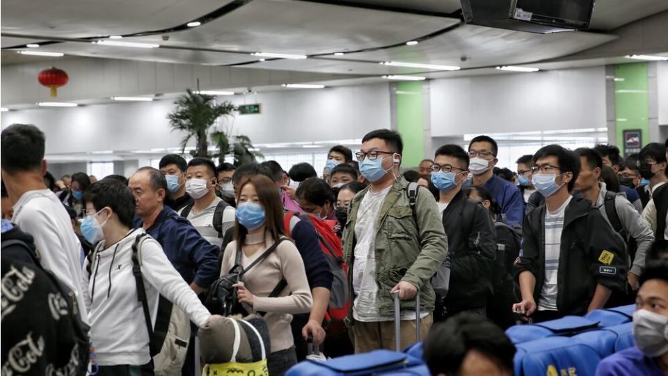 Passengers and staff at the Luohu railway station have put on masks in Shenzhen, China. | Barcroft Media/Getty Images