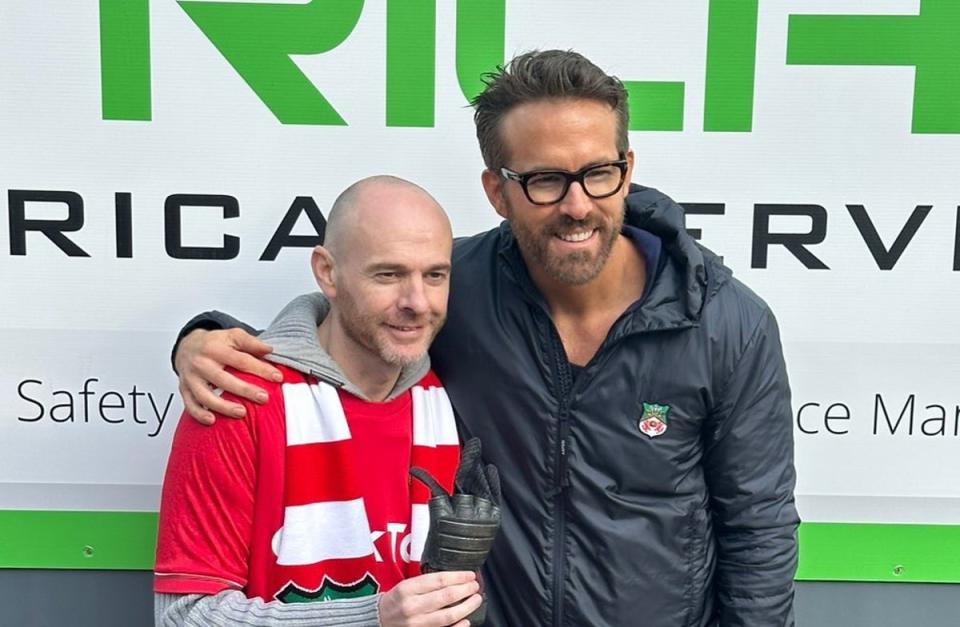 Ryan Reynolds presents Wrexham fan Jay Fear with his glove from Deadpool 2 (Ryan Reynolds Instagram (https://www.instagram.com/vancityreynolds/))