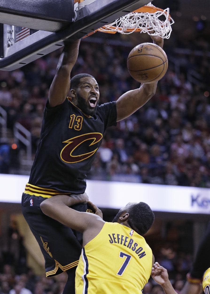 Cleveland Cavaliers' Tristan Thompson, top, dunks the ball against Indiana Pacers' Al Jefferson in the first half of an NBA basketball game, Wednesday, Feb. 15, 2017, in Cleveland. (AP Photo/Tony Dejak)