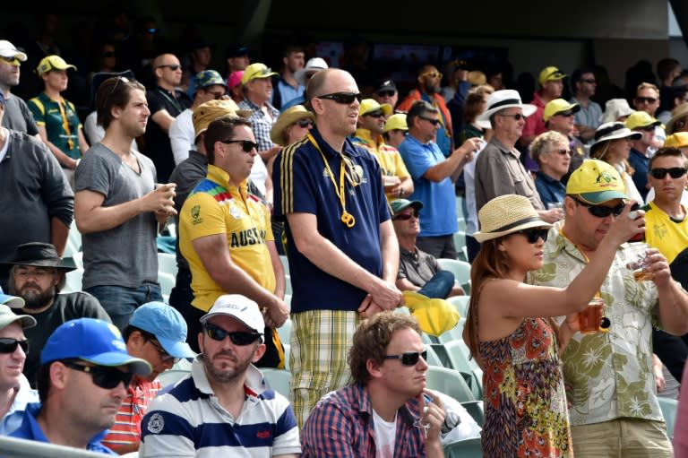 Spectators pay their respects to the late Phillip Hughes during the first day-night Test match, between Australia and New Zealand, at the Adelaide Oval, on November 27, 2015