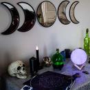 <p><strong>Black Magic Witch</strong></p><p>amazon.com</p><p><strong>$24.99</strong></p><p>Simply hang these moon mirrors in your windows with a little fishing line, and the neighborhood kids will have a fun time checking out their costumes while they approach your house for candy. </p>