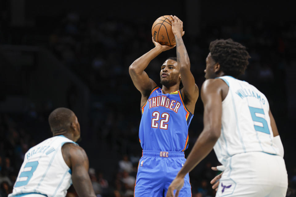 Oct 15, 2023; Charlotte, North Carolina, USA; Oklahoma City Thunder guard <a class="link " href="https://sports.yahoo.com/nba/players/10107" data-i13n="sec:content-canvas;subsec:anchor_text;elm:context_link" data-ylk="slk:Cason Wallace;sec:content-canvas;subsec:anchor_text;elm:context_link;itc:0">Cason Wallace</a> (22) shoots over Charlotte Hornets guard <a class="link " href="https://sports.yahoo.com/nba/players/5476" data-i13n="sec:content-canvas;subsec:anchor_text;elm:context_link" data-ylk="slk:Terry Rozier;sec:content-canvas;subsec:anchor_text;elm:context_link;itc:0">Terry Rozier</a> (3) in the first half at Spectrum Center. Mandatory Credit: Nell Redmond-USA TODAY Sports