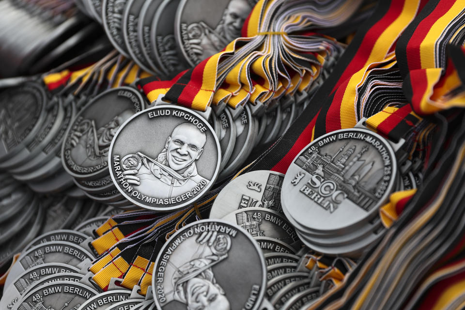 A portrait of Eliud Kipchoge is depicted on the participant medals of the Berlin Marathon which are stored in the finish area during the Berlin Marathon in Berlin, Germany, Sunday, Sept. 25, 2022. (AP Photo/Christoph Soeder)