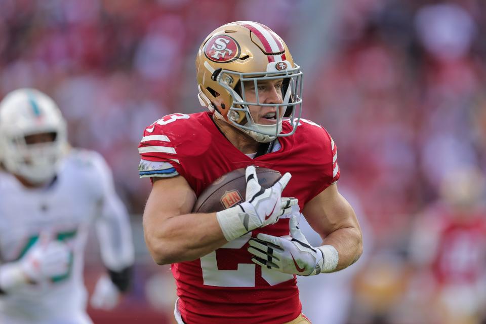 San Francisco running back Christian McCaffrey looks for yards after a catch against the Dolphins.