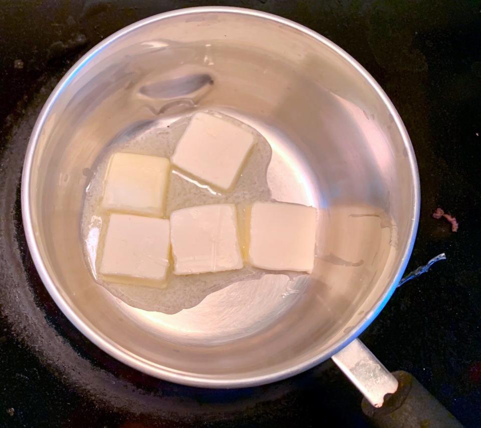 Four knobs of butter in a pan over the stove