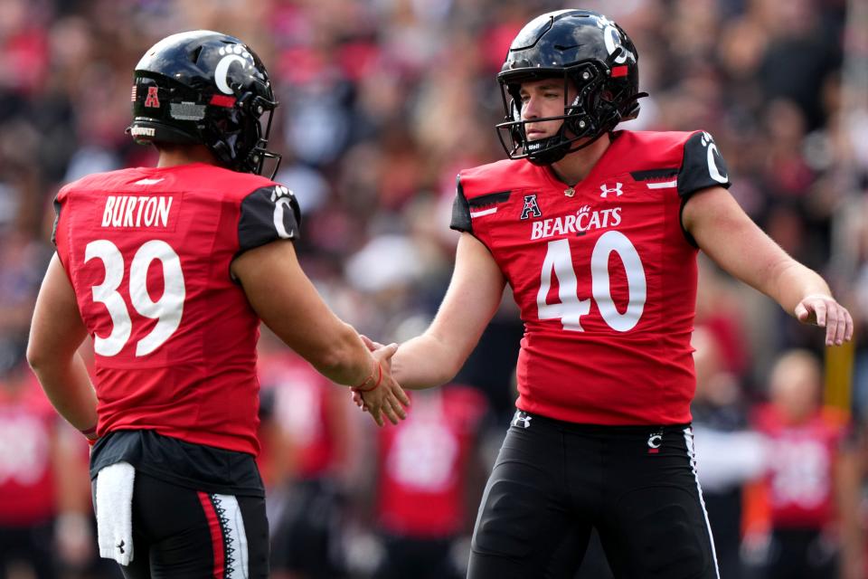 Last year's UC place kicker Ryan Coe (40) is congratulated by holder Bryce Burton (39)) after a successful field goal in the first quarter of a Saturday, Sept. 24, 2022, at Nippert Stadium in Cincinnati.
(Photo: Kareem Elgazzar/The Enquirer)