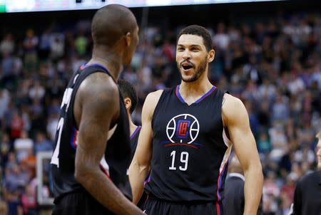 Apr 8, 2016; Salt Lake City, UT, USA; Los Angeles Clippers guard Jamal Crawford (11) celebrates with teammate forward Jeff Ayres (19) after hitting the game winning shot in overtime against the Utah Jazz at Vivint Smart Home Arena. The Los Angeles Clippers defeated the Utah Jazz 102-99 in overtime. Mandatory Credit: Jeff Swinger-USA TODAY Sports