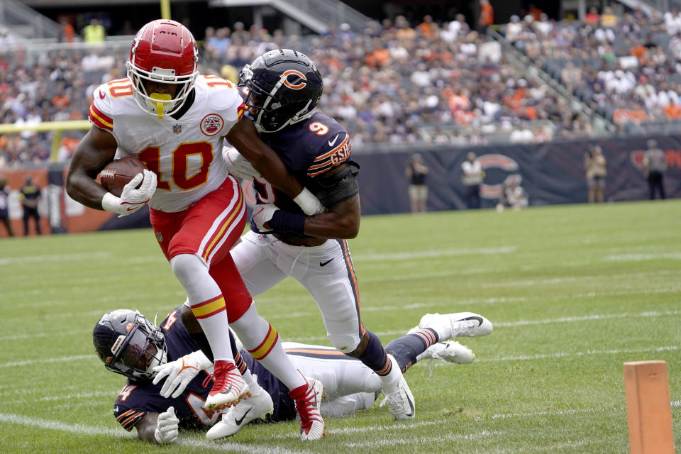 Kansas City Chiefs running back Isiah Pacheco is driven out of bounds near the goal line by Chicago Bears safety Jaquan Brisker in the first half of an NFL preseason football game Saturday, Aug. 13, 2022, in Chicago. (AP Photo/David Banks)