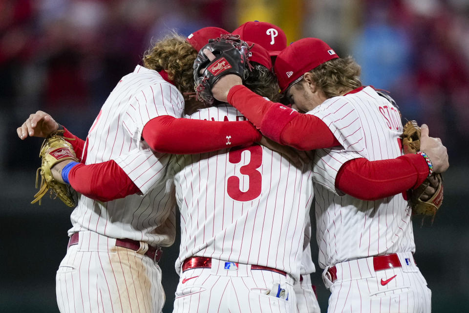 The Philadelphia Phillies celebrate their win against the Arizona Diamondbacks in Game 1 of the baseball NL Championship Series in Philadelphia, Monday, Oct. 16, 2023. The Phillies won 5-3 to take a 1-0 lead in the series. (AP Photo/Matt Slocum)