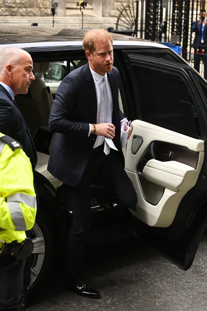 Prince Harry gets out of a car outside of the High Court