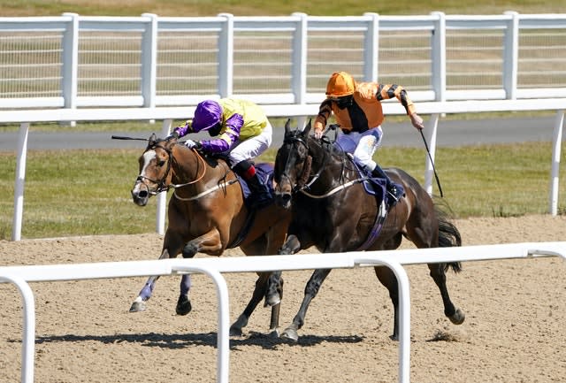 Zodiakos (orange) and jockey James Sullivan en route to a memorable victory in Newcastle.