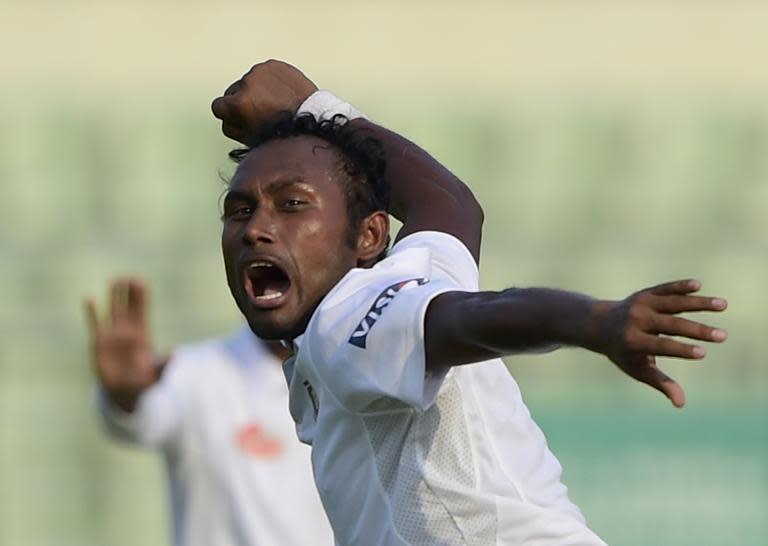 Bangladesh bowler Mohammad Shahid reacts after the dismissal of Pakistan batsman Younis Khan on the first day of the second Test in Dhaka on May 6, 2015