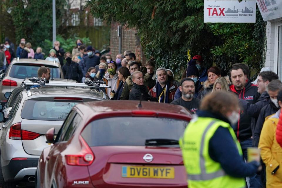 People queuing for booster jabs at Sevenoaks Pharmacy in Kent (PA)