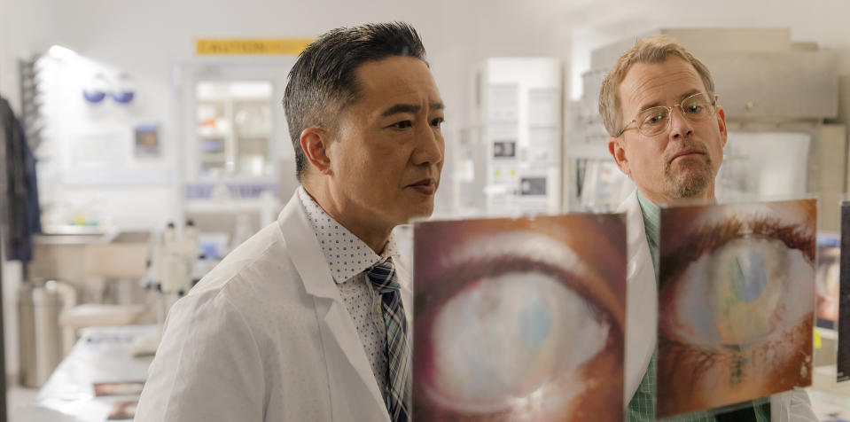 This image released by Angel Studios shows Terry Chen, left, and Greg Kinnear in a scene from "Sight." (Angel Studios via AP)