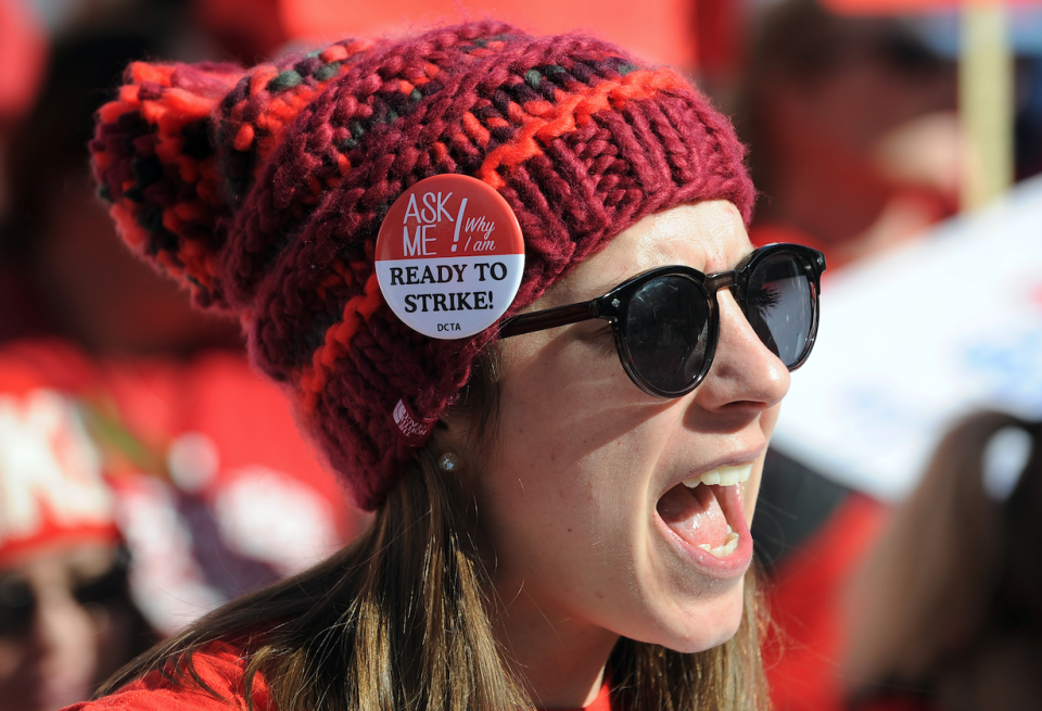 McAuliffe International School seventh grade teacher Margaret Flynn reacts during a rally in Civic Center Park as Denver public school teachers strike for a second day in Denver, Colorado, U.S., February 12, 2019. (photo: REUTERS/Michael Ciaglo)