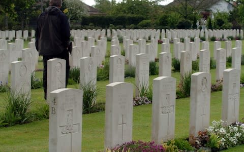 Gravestones of British servicemen who died during the Normandy landings, at the Ranville Cemetery - Credit: Paul Grover