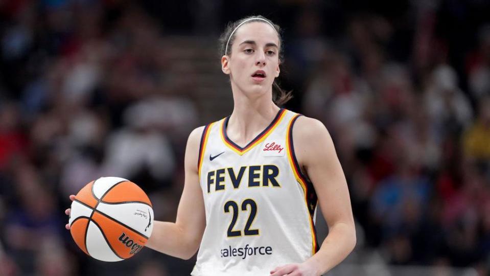 Caitlin Clark dribbles the basketball during a game against the Connecticut Sun on 20 May