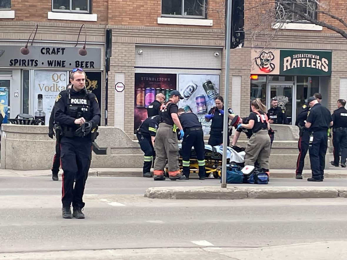 A 15-year-old stabbing victim is loaded onto a stretcher downtown on April 8. (Dan Zakreski/CBC - image credit)