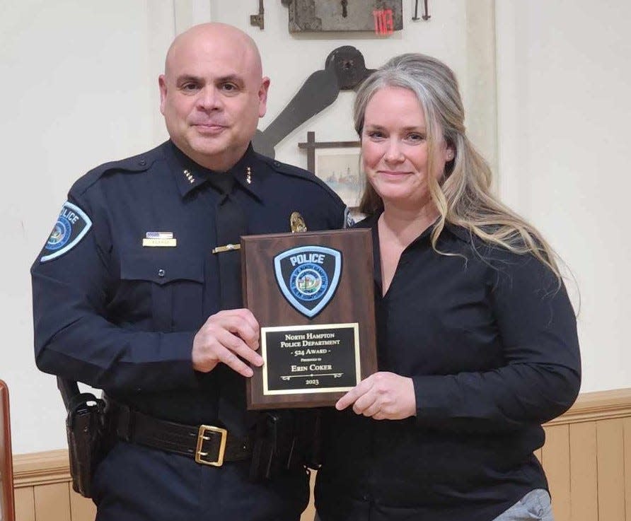 North Hampton Police Chief Robert LaBarge presented the department’s “524" award to Erin Coker, the police administrative assistant.