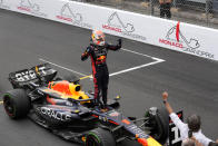 Red Bull driver Max Verstappen of the Netherlands celebrates as he stands on his car after winning the Monaco Formula One Grand Prix, at the Monaco racetrack, in Monaco, Sunday, May 28, 2023. (AP Photo/Luca Bruno)