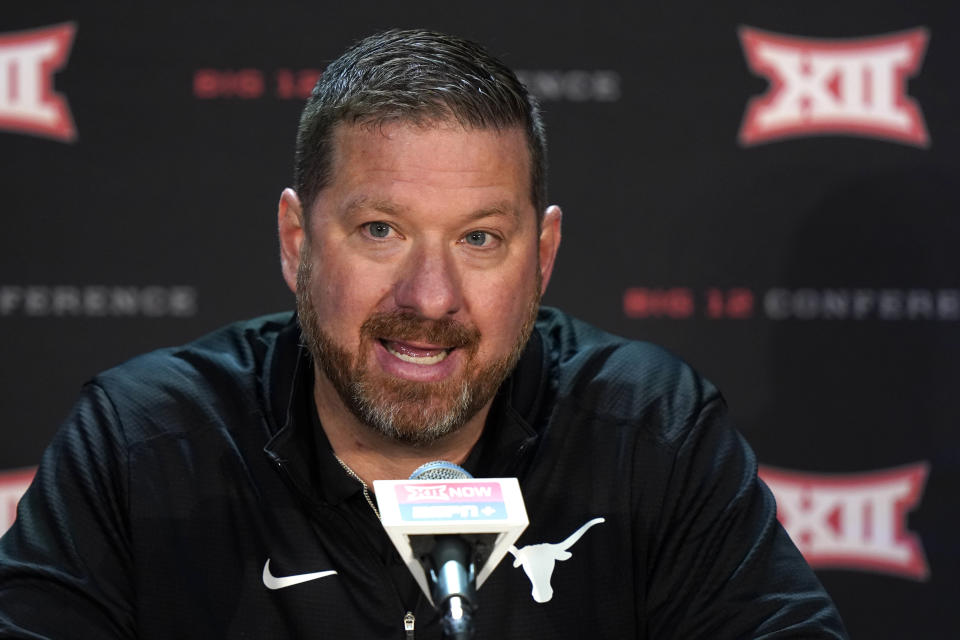 FILE -Texas coach Chris Beard speaks to the media during Big 12 NCAA college basketball media day Oct. 20, 2021, in Kansas City, Mo. Former national runner-up coach Chris Beard left Texas Tech for Texas where he replaced Shaka Smart who landed at Marquette. Porter Moser, who became a lead candidate for seemingly every major job after leading Loyola to the Final Four, became the replacement for Lon Kruger at Oklahoma. (AP Photo/Charlie Riedel)