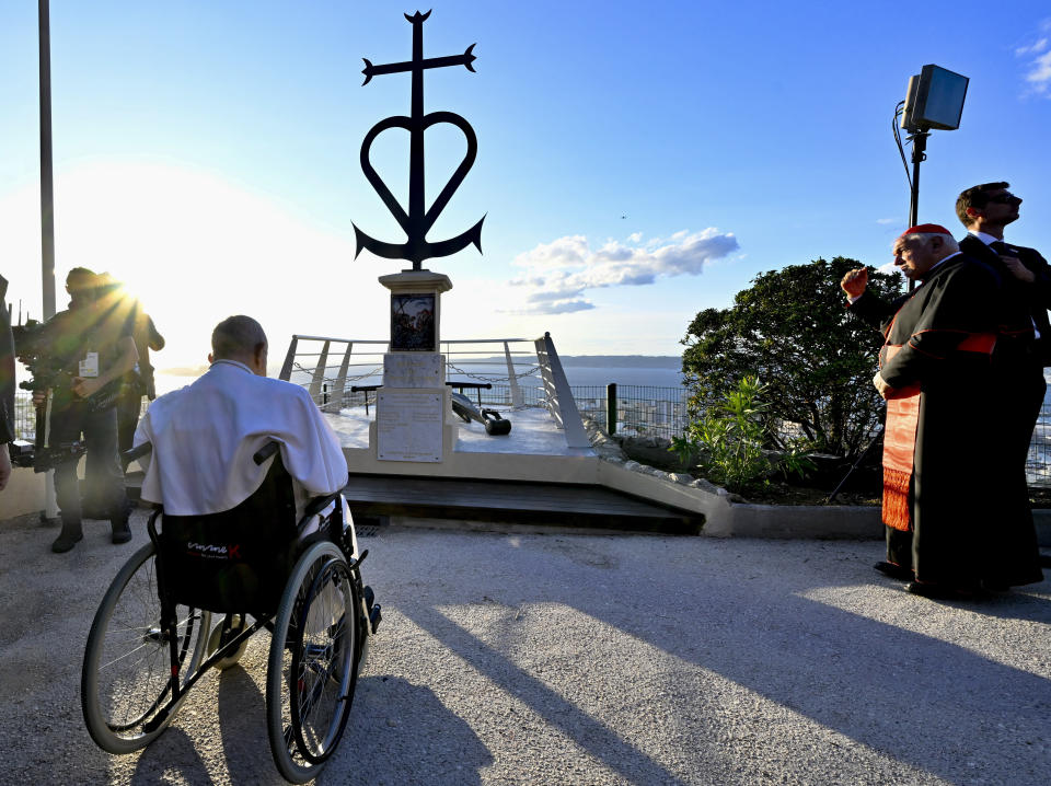 Pope Francis prays in front of the Memorial dedicated to sailors and migrants lost at sea during a moment of reflection with religious leaders, in Marseille, France, Friday, Sept. 22, 2023. Francis, during a two-day visit, will join Catholic bishops from the Mediterranean region on discussions that will largely focus on migration. (Alessandro Di Meo/ANSA via AP, Pool)
