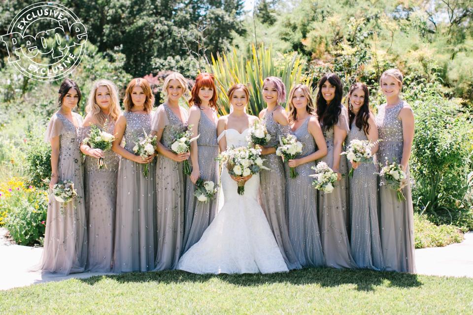 “I was a bridesmaid in Ashley [Tisdale]’s wedding. Shelley [Buckner] and Vanessa [Hudgens] were bridesmaids in her wedding,” says Hidalgo, who chose grey beaded <a href="https://click.linksynergy.com/deeplink?id=93xLBvPhAeE&mid=43069&murl=https%3A%2F%2Fwww.adriannapapell.com%2F&u1=PEO%2CSeeBridesmaidsVanessaHudgensandAshleyTisdale%27sGlamorousLooksatPalKimHidalgo%E2%80%99sWedding%2Cmchiupeople%2CUnc%2CPos%2C7117421%2C201906%2CI" rel="nofollow noopener" target="_blank" data-ylk="slk:Adrianna Papell;elm:context_link;itc:0;sec:content-canvas" class="link ">Adrianna Papell</a> dresses for her bridal party. “I was a bridesmaid in Samantha [Droke]’s wedding with Shelley and Ashley. We’re all a close-knit group of girlfriends.” Daugherty’s sister, Caitey, along with a few of Hidalgo’s friends from home, were also in her bridal party. On her wedding day, Hidalgo gifted her bridesmaids robes by <a href="https://kimandono.com/" rel="nofollow noopener" target="_blank" data-ylk="slk:KIM + ONO;elm:context_link;itc:0;sec:content-canvas" class="link ">KIM + ONO</a>, pieces by <a href="https://www.gldn.com/" rel="nofollow noopener" target="_blank" data-ylk="slk:GLDN;elm:context_link;itc:0;sec:content-canvas" class="link ">GLDN</a> and makeup by <a href="http://prf.hn/click/camref:1011l5epi/pubref:PEO%2CSeeBridesmaidsVanessaHudgensandAshleyTisdale%27sGlamorousLooksatPalKimHidalgo%E2%80%99sWedding%2Cmchiupeople%2CUnc%2CPos%2C7117421%2C201906%2CI/destination:https%3A%2F%2Fwww.charlottetilbury.com%2Fus" rel="nofollow noopener" target="_blank" data-ylk="slk:Charlotte Tilbury;elm:context_link;itc:0;sec:content-canvas" class="link ">Charlotte Tilbury</a>.
