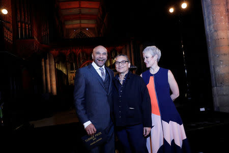 Artist Lubaina Himid (C) poses with DJ Goldie (L) and Tate Director Maria Balshaw after being announced as the winner of the Turner Prize in Hull, Britain December 5, 2017. REUTERS/Darren Staples